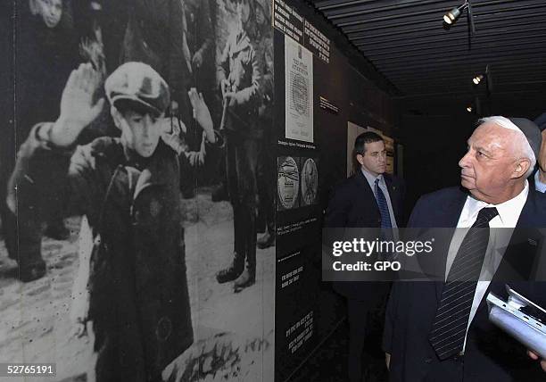 In this handout photo from the Israeli Government Press Office , Israeli Prime Minister Ariel Sharon looks at of Jews under Nazi occupation before...