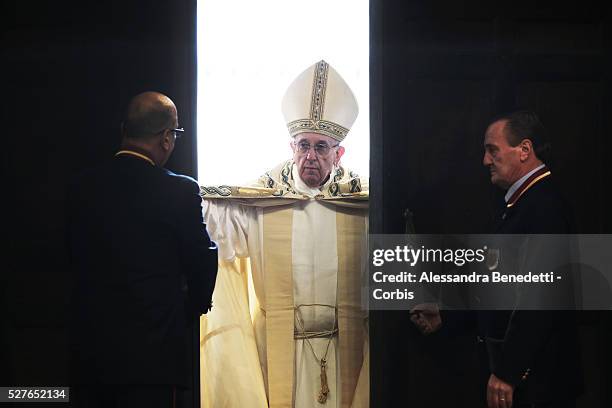 Pope Francis opens the Holy Door at St. Peter's Basilica on the opening day of the Extraordinary Jubileum of Mercy at the Vatican and in the World.