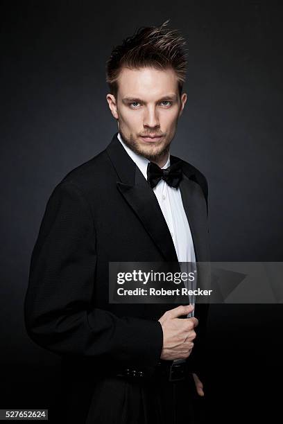 studio portrait of young wearing tailcoat - black tuxedo stock pictures, royalty-free photos & images