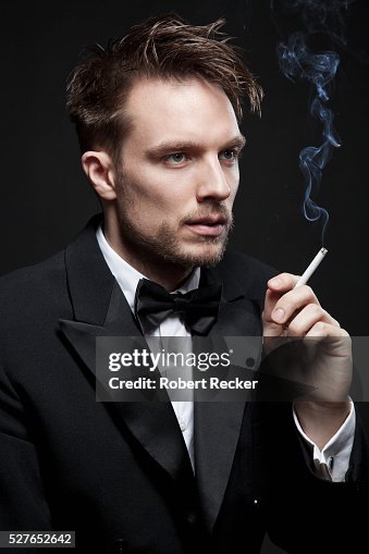 man in suit smoking cigarette 1,622 Stock Photos, High-Res Pictures, and Images A man in a suit