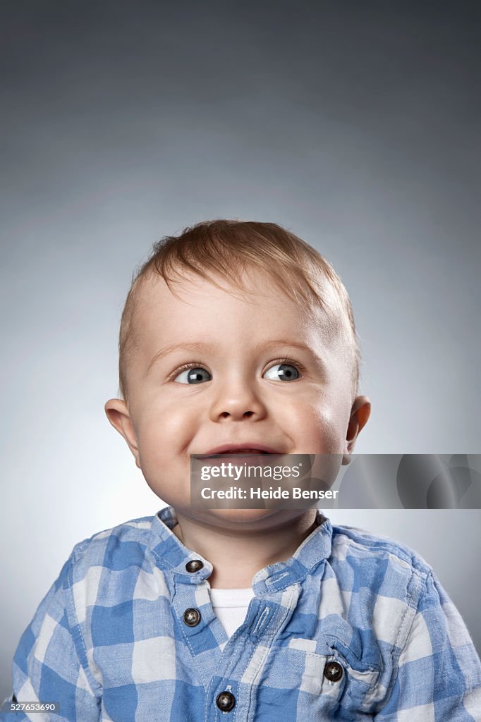 Portrait of baby boy (12-23 months) in checked shirt