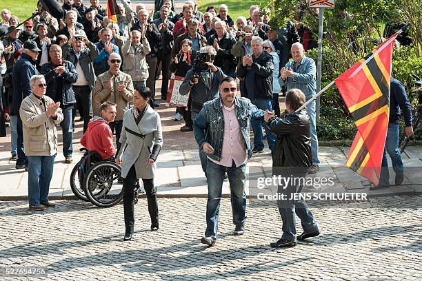 Lutz Bachmann , co-founder of Germany's xenophobic and anti-Islamic PEGIDA movement and his wife Vicky Bachmann arrive for the continuation of his...