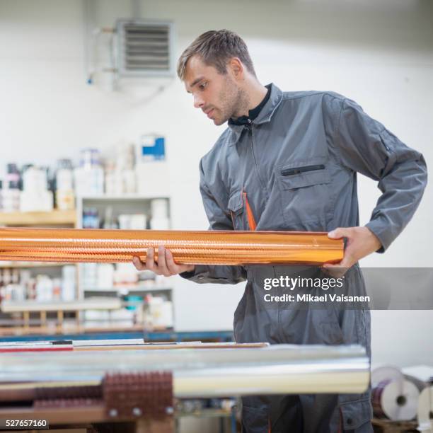 technician at work in label printing company - label printing machine stock-fotos und bilder