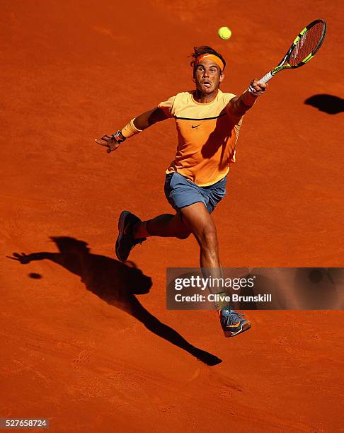 Rafael Nadal of Spain leaps into the air to play a forehand against Andrey Kuznetsov of Russia in their second round match during day four of the...