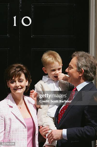 Britain's Prime Minister Tony Blair poses for photographers along with wife Cherie and son Leo after returning to 10 Downing Street on May 6, 2005 in...