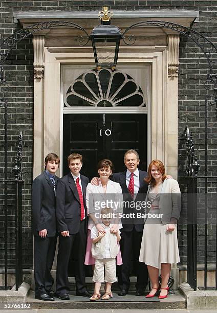 Britain's Prime Minister Tony Blair poses for photographers along with his family sons Nicky, Euan, wife Cherie, son Leo and daughter Kathryn after...
