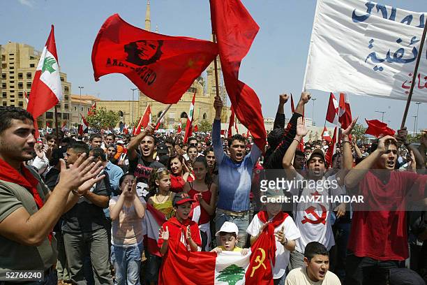 Supporters of the Lebanese Communist party shout slogans during a demonstration against a controversial electoral law in Beirut 06 May 2005....