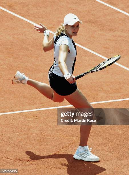 Nadia Petrova of Russia in action against Amelie Mauresmo of France during the Qatar Total German Open on May 6, 2005 in Berlin, Germany.