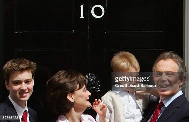 Britain's Prime Minister Tony Blair poses for photographers along with son Euan , wife Cherie and son Leo after returning to 10 Downing Street on May...