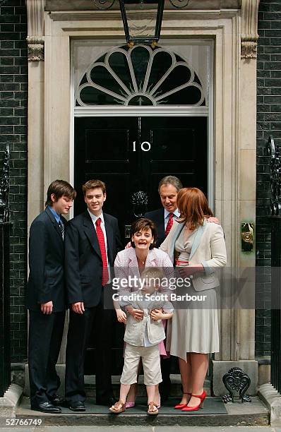 Britain's Prime Minister Tony Blair poses for photographers along with sons Nicky, Euan, wife Cherie, son Leo and daughter Kathryn on the doorstep...