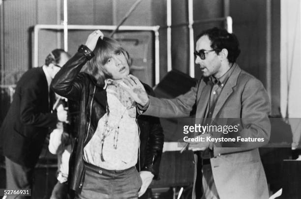 Jean-Luc Godard directs Brian Jones of the Rolling Stones during the shooting of the documentary film 'Sympathy For the Devil' , 30th July 1968.