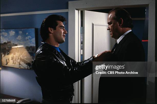 American actor Ken Wahl straightens the tie of guest star Fred Thompson in a scene from the television series 'Wiseguy,' 1987. Thompson would go on...