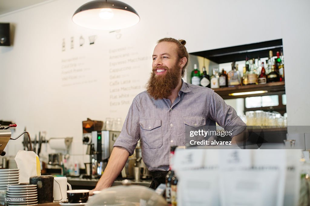 Barista standing at a coffee shop