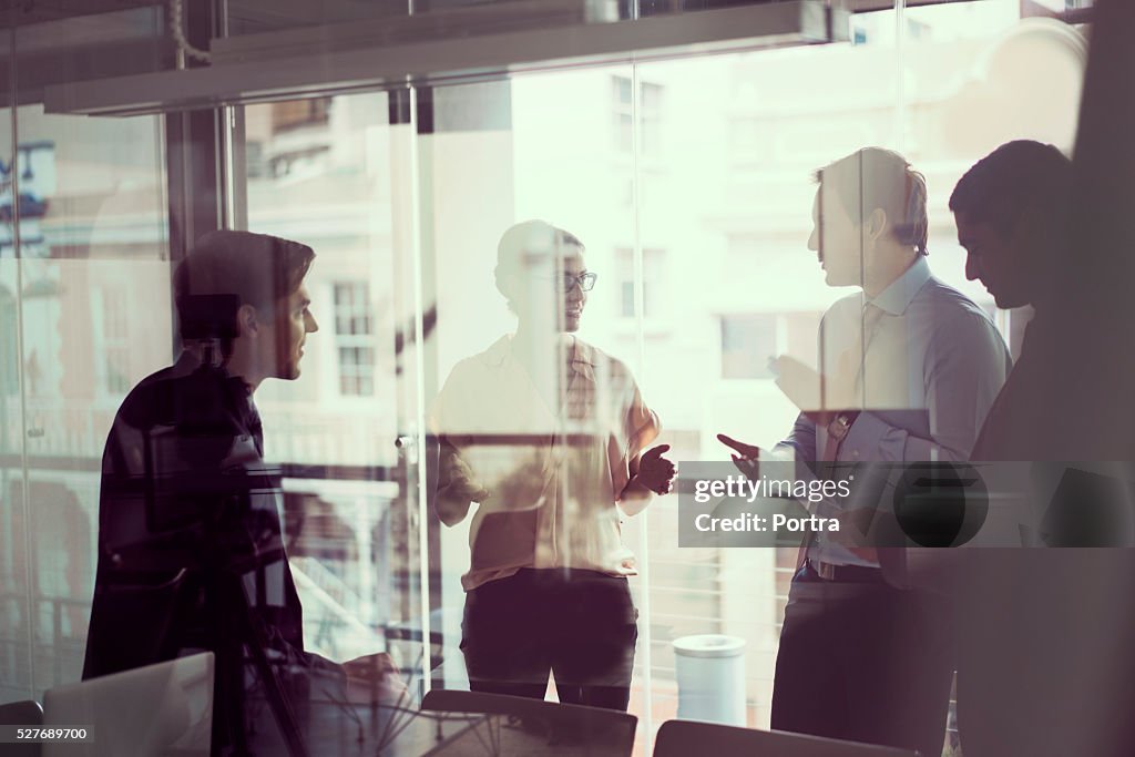 Business people having discussion in modern office