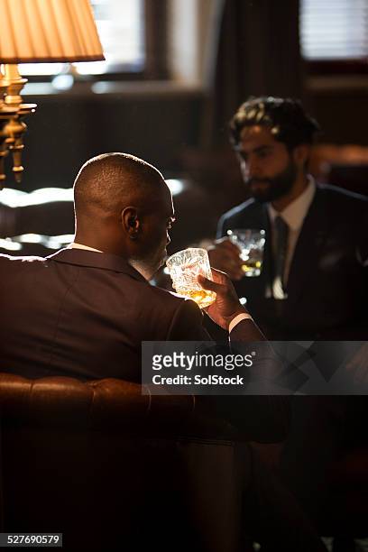 men drinking whisky - whiskey stock pictures, royalty-free photos & images