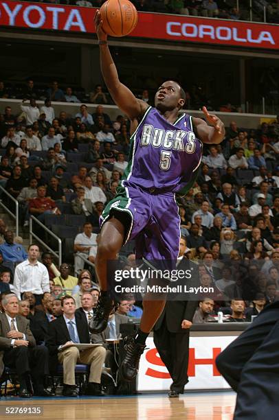 Anthony Goldwire of the Milwaukee Bucks drives to the basket for a layup against the Washington Wizards during the game on April 11th, 2005 at the...