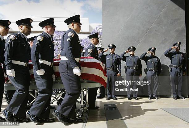 Los Angeles Airport Police officers carry the casket bearing the remains of fellow officer Tommy Edward Scott at Our Lady of the Angels Cathedral May...