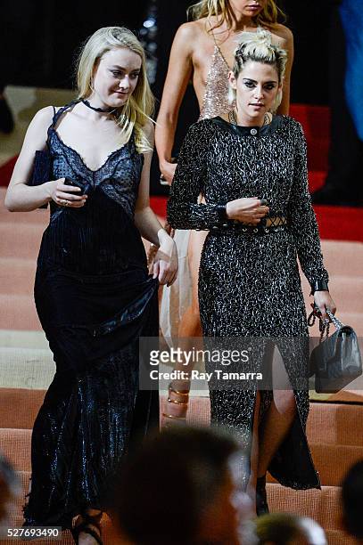 Actresses Dakota Fanning and Kristen Stewart leave the "Manus x Machina: Fashion In An Age Of Technology" Costume Institute Gala at the Metropolitan...