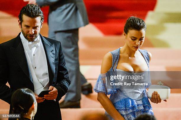 Actor Bradley Cooper and model Irina Shayk leave the "Manus x Machina: Fashion In An Age Of Technology" Costume Institute Gala at the Metropolitan...