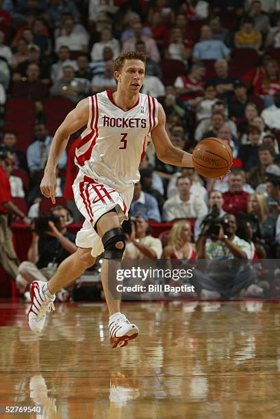 Bob Sura of the Houston Rockets drives against the Memphis Grizzlies during the game at Toyota Center on April 13, 2005 in Houston, Texas. The...