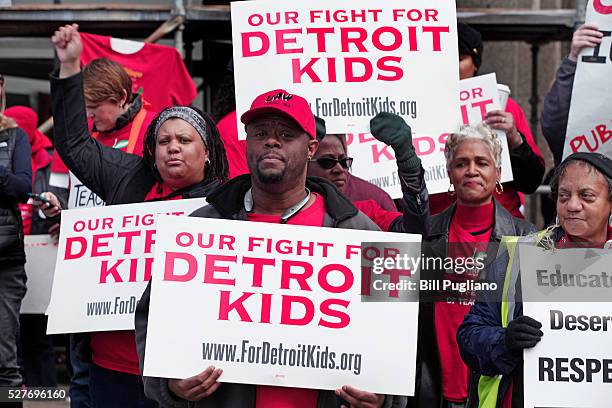 Detroit teachers stage a sick-out for the second day in a row and protest in front of Detroit Public Schools headquarters, causing 94 of the 97...