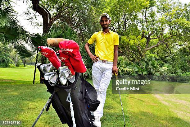 Golfer Rashid Khan poses for a profile shoot in Delhi Golf Club on August 18, 2015 in New Delhi, India.