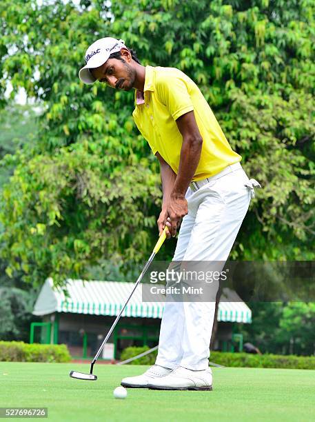 Golfer Rashid Khan poses for a profile shoot in Delhi Golf Club on August 18, 2015 in New Delhi, India.