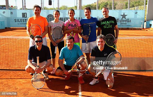 Lara Arruabarrena and Silvia Soler Espinosa of Spain pose for a group photograph after taking part in an Amex clinic during day four of the Mutua...