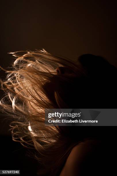 woman flipping hair - hair toss stock pictures, royalty-free photos & images