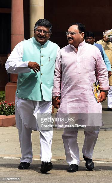 Union Minister of Health and Family Welfare Jagat Prakash Nadda talking to Union Minister of Communications and Information Technology Ravi Shankar...
