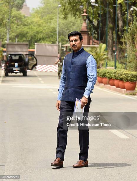 Lieutenant-Colonel AVSM and I&B Minister Rajyavardhan Singh Rathore leaves after attending the BJP Parliamentary Board Meeting at Parliament Library...