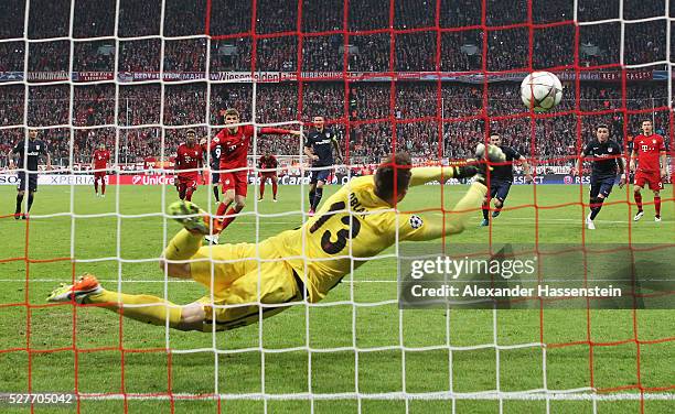 Goalkeeper Jan Oblak of Atletico Madrid saves a penalty kick from Thomas Mueller of Bayern Munich during UEFA Champions League semi final second leg...