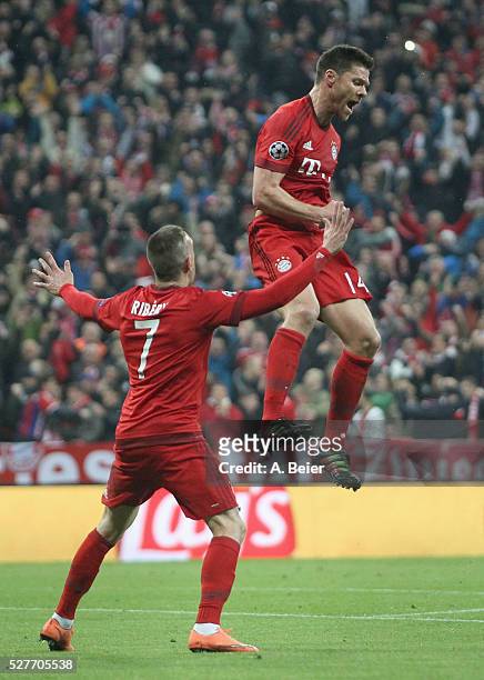 Xabi Alonso of Bayern Muenchen celebrates his first goal with teammate Franck Ribery during the Champions League semi final second leg match between...