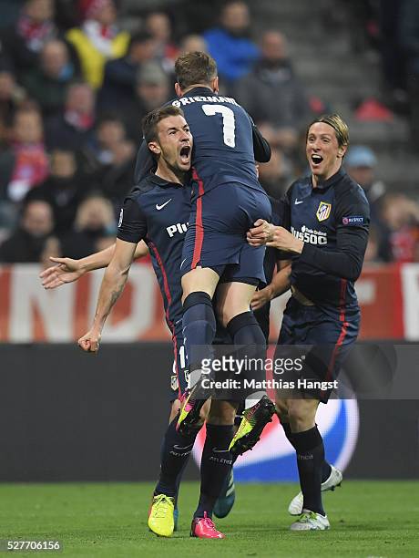 Antoine Griezmann of Atletico Madrid celebrates with Gabi and Fernando Torres as he scores their first goal during UEFA Champions League semi final...
