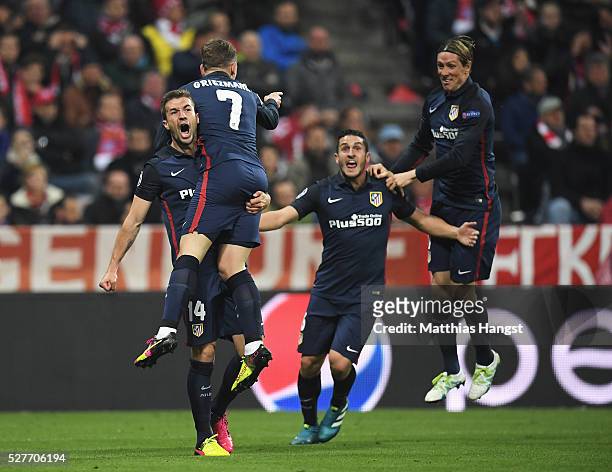 Antoine Griezmann of Atletico Madrid celebrates with Gabi , Koke and Fernando Torres as he scores their first goal during UEFA Champions League semi...