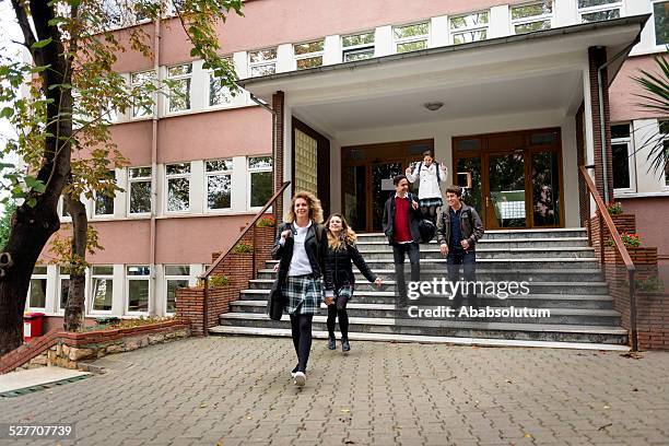 happy turkish students leaving school, istanbul - high school building entrance stock pictures, royalty-free photos & images