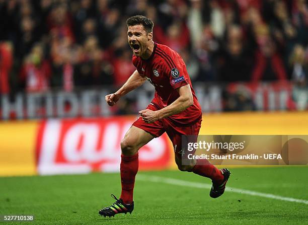 Xabi Alonso of Muenchen celebrates scoring his goal during the UEFA Champions League Semi Final second leg match between FC Bayern Muenchen and Club...