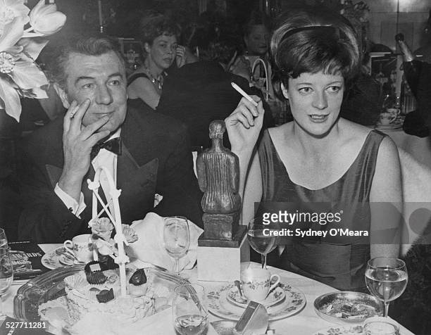 English actor and director Michael Redgrave with English actress Maggie Smith at the Evening Standard theatre awards at the Savoy Hotel, London, 29th...