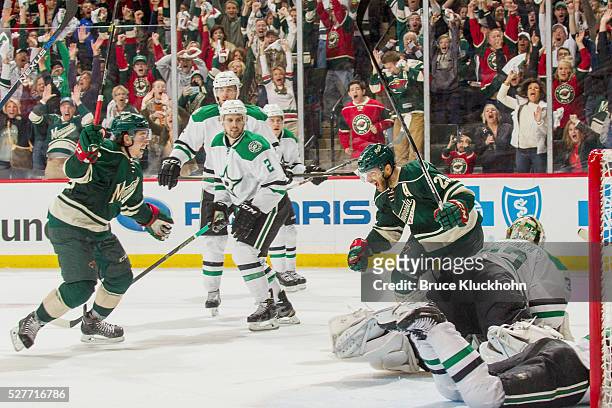 Erik Haula and Jason Pominville of the Minnesota Wild celebrate after scoring a goal against the Dallas Stars in Game Six of the Western Conference...