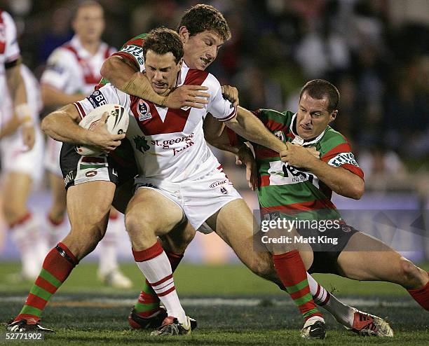 Colin Best of the Dragons is tackled by the Rabbitohs defence during the round nine NRL match between the St George-Illawarra Dragons and the South...