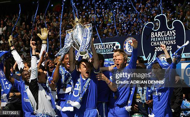 Chelsea's Captain John Terry lifts the Barclays Premiership trophy alongside the rest of the team during the celebration after the game against...