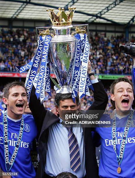 Chelsea's Manager Jose Mourinho holds aloft the Barclays Premiership trophy beside Frank Lampard and John Terry during the celebrations after the...