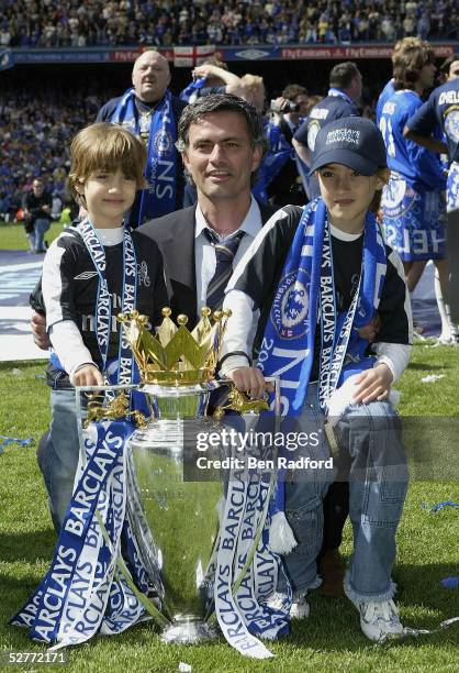 Jose Mourinho poses with his children Zuca and Matilde and the Barclays Premiership Trophy at Stamford Bridge on May 7, 2005 in London, England.