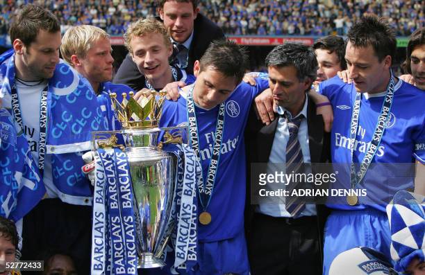 Chelsea players Petr Cech John Terry and Frank Lampard look at the trophy with their Manager Jose Mourinho during the celebrations following the game...