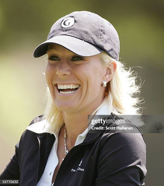 Danielle Amiee, winner of the Golf Channel's Big Break III, laughs on the ninth hole during the second round of the Michelob Ultra Open on May 7,...