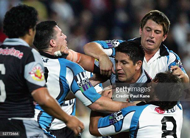 Steve Price of the Warriors gets tackled during the round nine NRL match between the Cronulla-Sutherland Sharks and the New Zealand Warriors at...