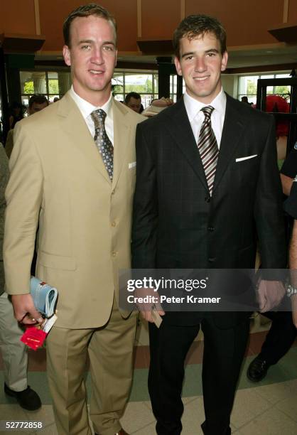 Football players Peyton Manning and Eli Manning arrive at the 131st Kentucky Derby at Churchill Downs racetrack on May 7, 2005 in Louisville,...