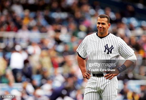 Alex Rodriguez of the New York Yankees can only smile after Mark Kotsay of the Oakland Athletics makes a leaping catch on a ball he hit to end the...