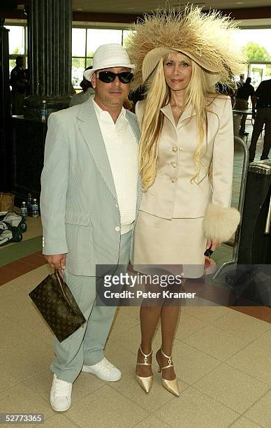 Reality television personality Victoria Gotti and her friend Robert arrives at the 131st Kentucky Derby at Churchill Downs racetrack on May 7, 2005...