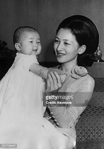 Empress Michiko of Japan with her daughter Sayako, Princess Nori, around the time of her 35th birthday in Tokyo, Japan, October 1969.